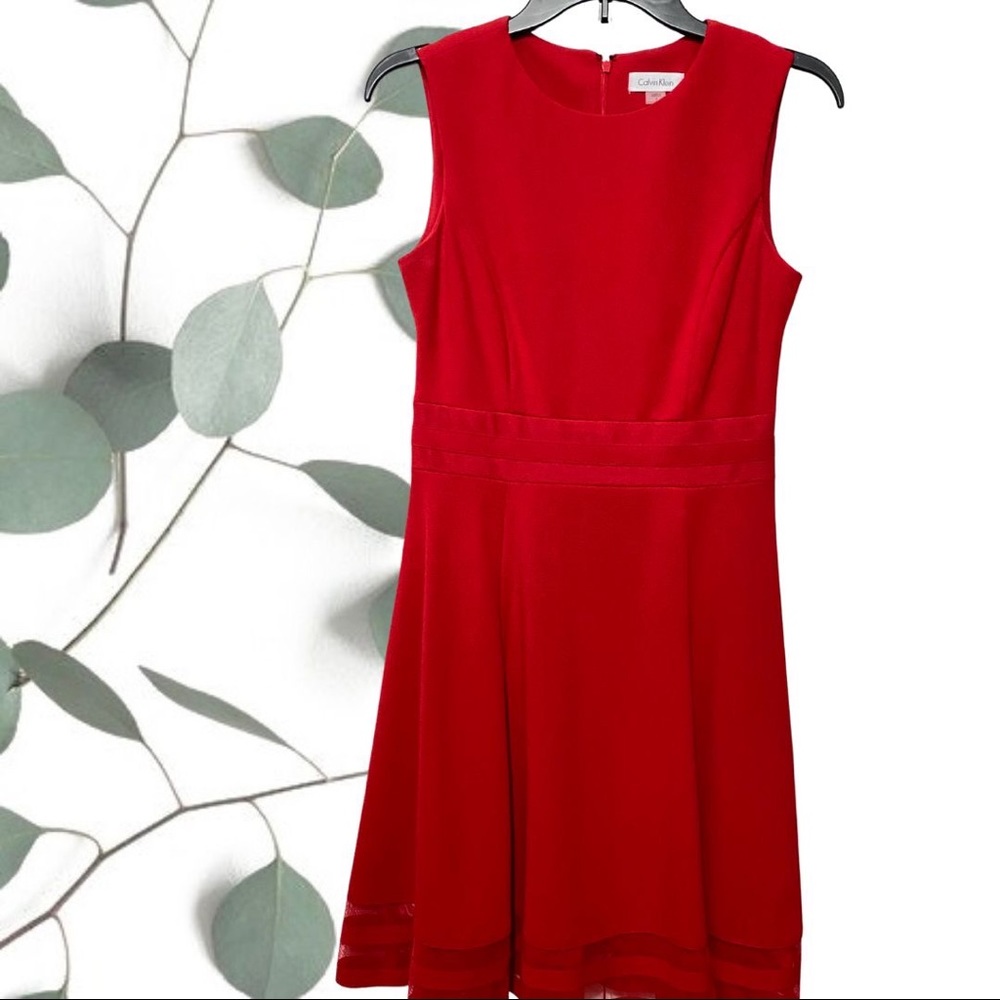 Red Calvin Klein a-line dress with hem detail in excellent condition.
